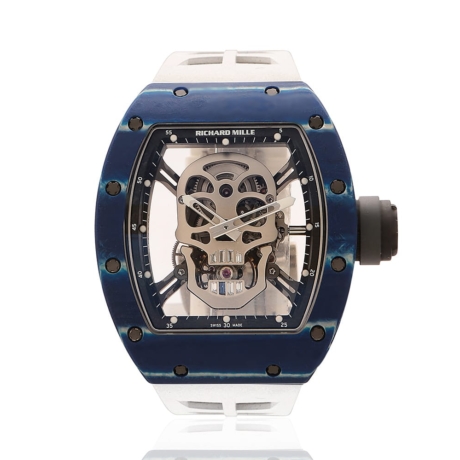Richard Mille blue carbon TPT Skull watch with white rubber band. Front of watch.