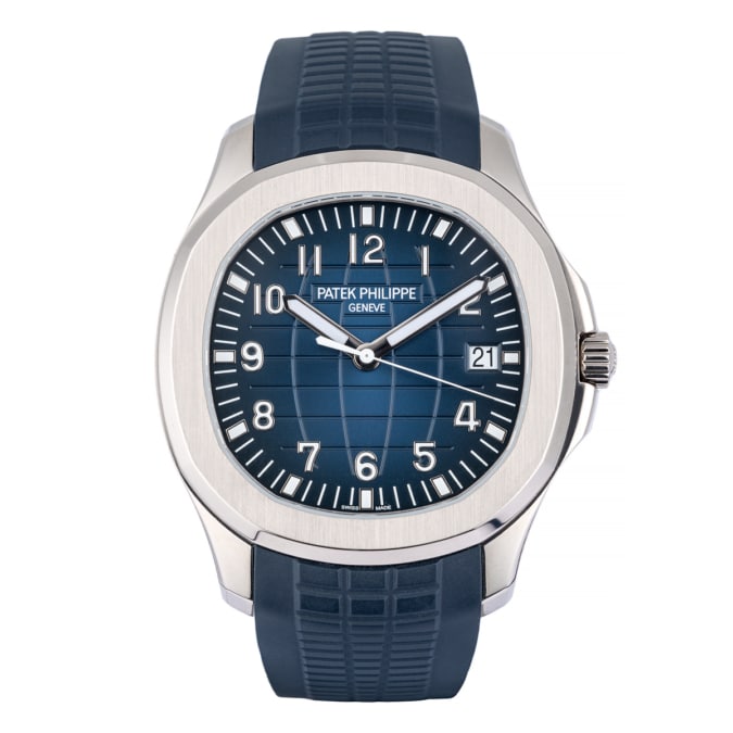 Patek Philippe Aquanaut watch with white gold case, blue embossed dial and blue strap. Front of watch.