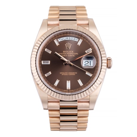 Rolex day date rose gold chocolate baguette diamond dial 40 mm showing dial.