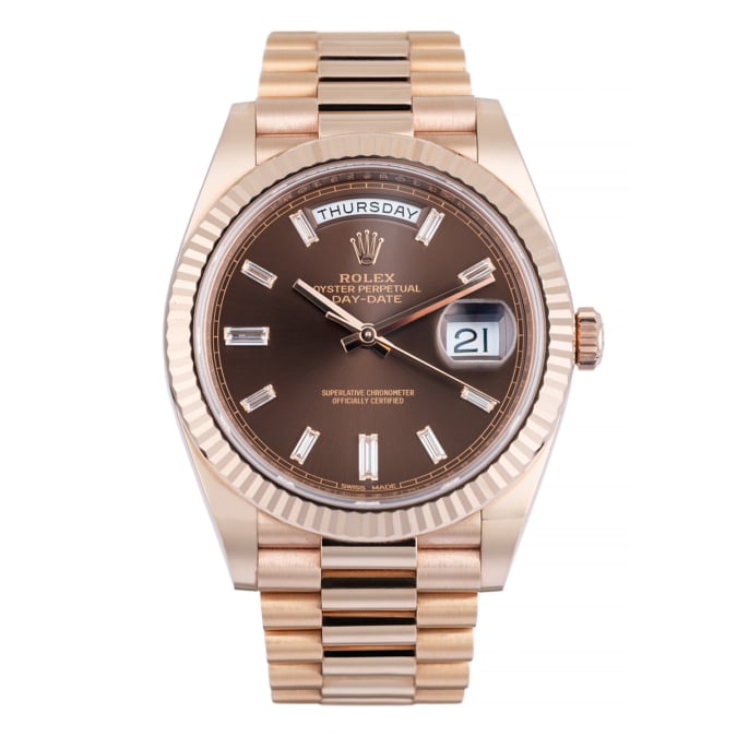 Rolex day date rose gold chocolate baguette diamond dial 40 mm showing dial.