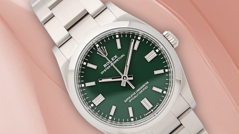 A Rolex Oyster Perpetual with a green dial